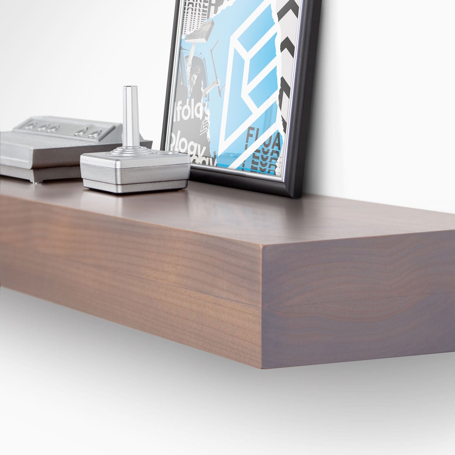 Glenn Hatch Grey Floating Mantel with minimalist design displaying modern decor and framed artwork on smooth wood surface