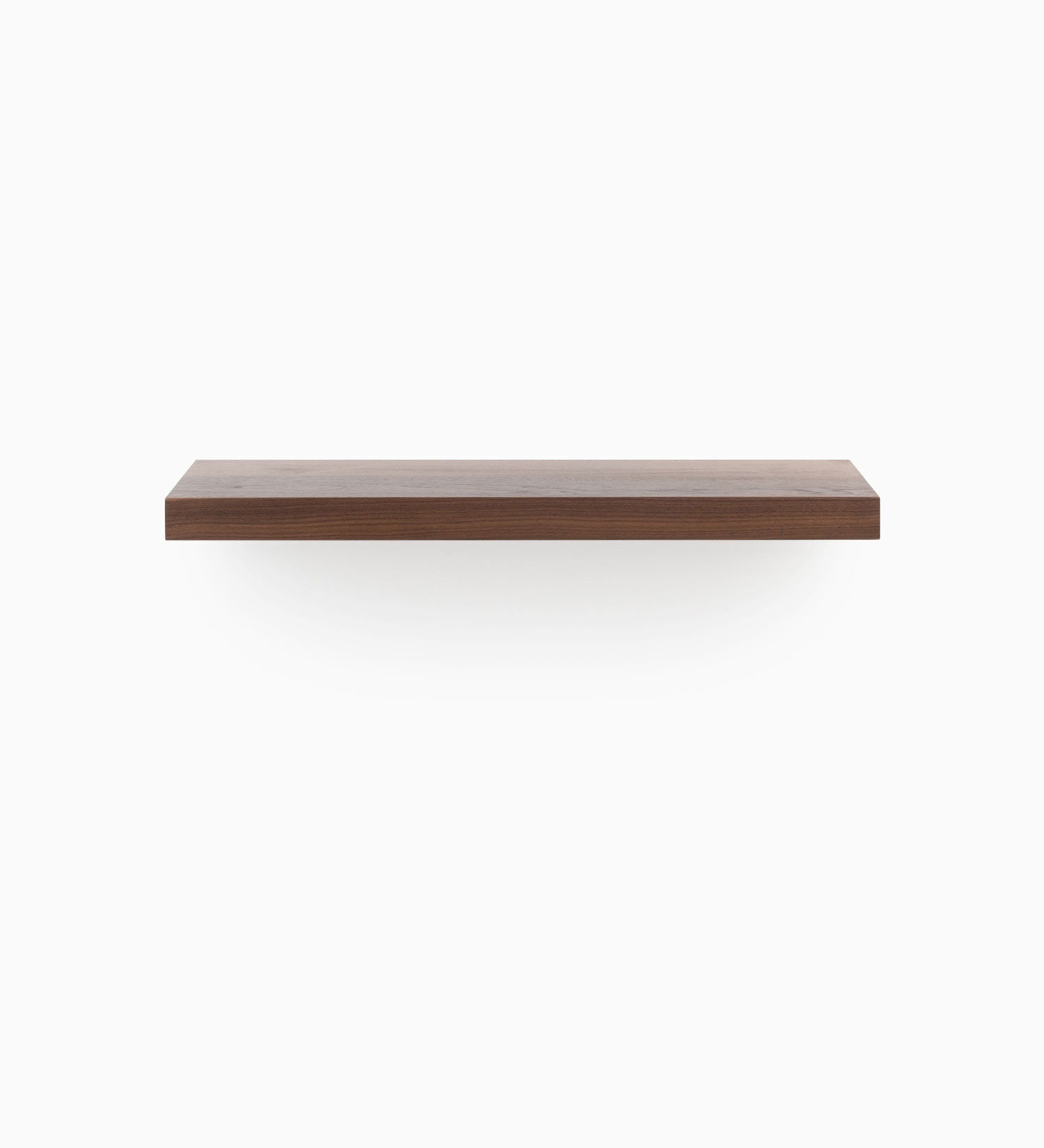 Aksel walnut floating shelf crafted from solid wood with a sleek, minimalist profile, front view
