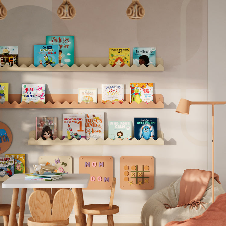 Light wood floating display ledges with children’s books and playful wall decor in a bright, cozy reading nook setting