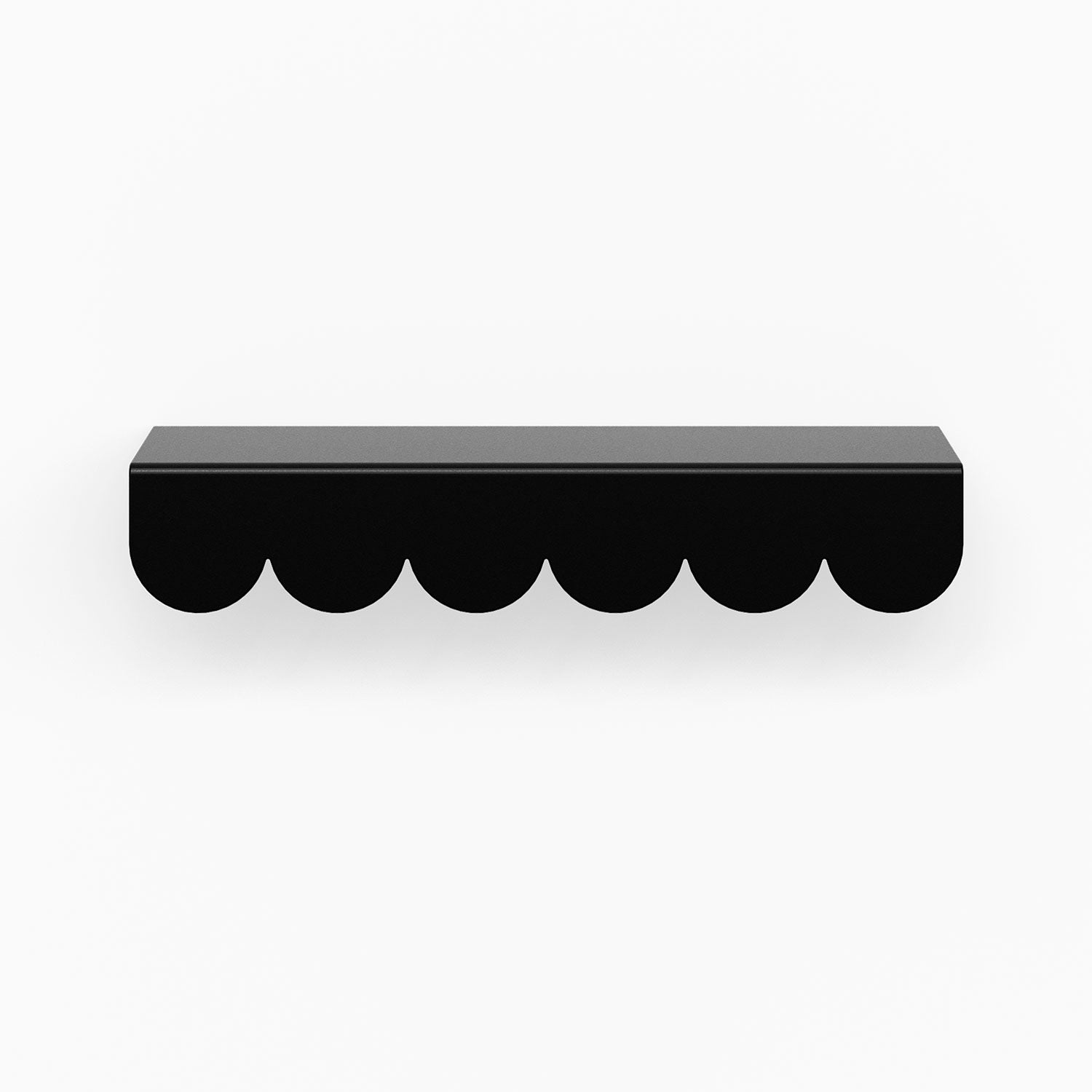 Bubble Cabinet Pull in matte black with scalloped edges offering durable and stylish hardware for floating shelf installation