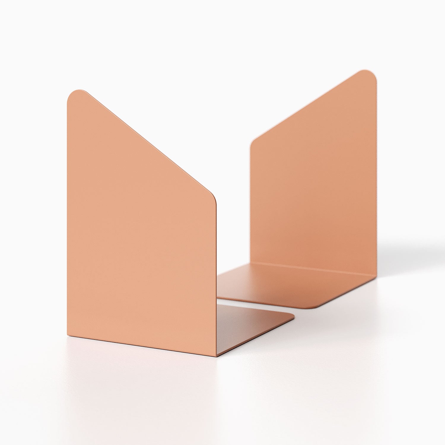 Geo Angle Bookend (Set of Two) in muted terracotta color with minimalist metal design ideal for organizing books on shelves or desks.