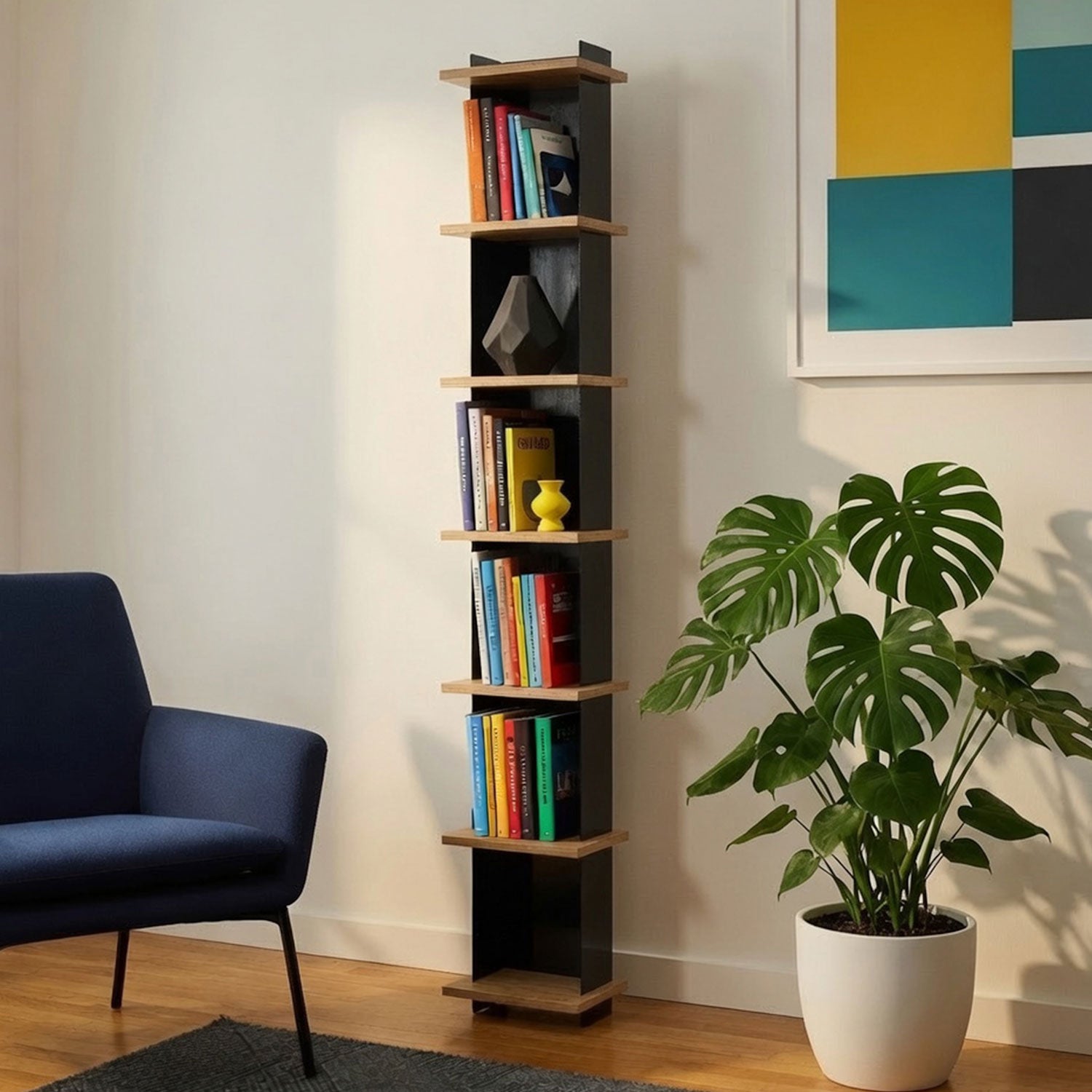 Halle Bookshelf in a modern room showcasing its minimalist wood and steel design, holding books and decorative items beside a plant and chair.