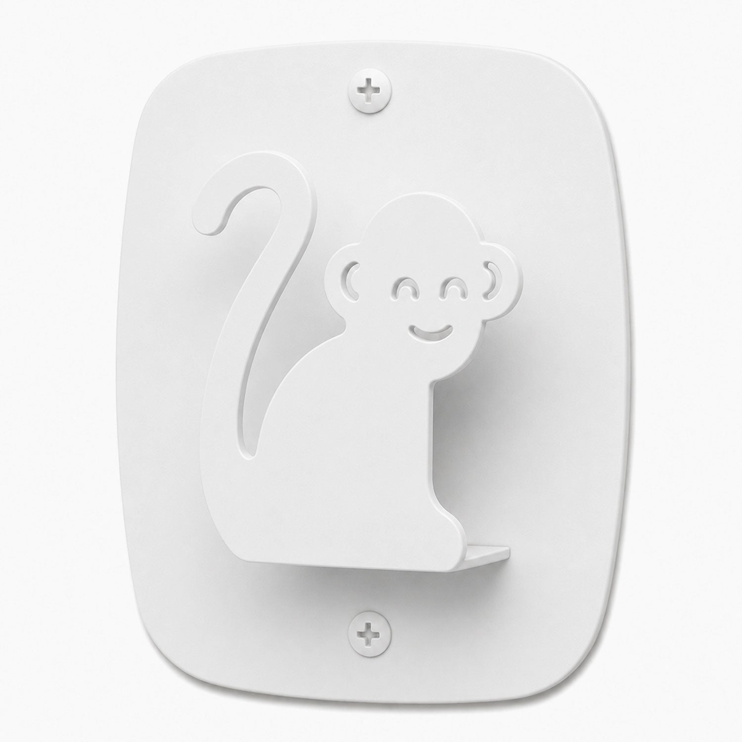 White minimalist wall hook shaped like a smiling monkey, made from durable rust-resistant material, designed as Kiddo Hooks for organizing spaces.