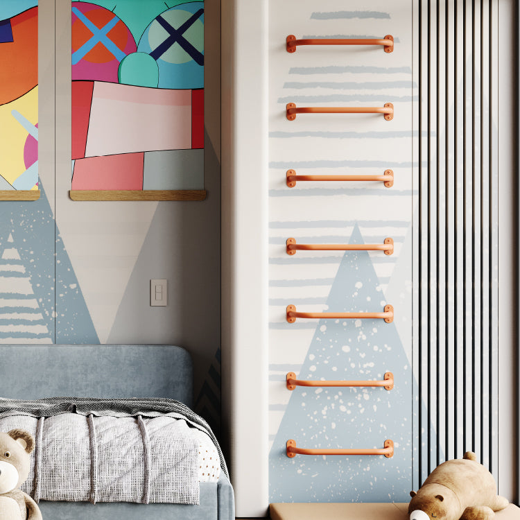 Wooden monkey bars mounted vertically on a child’s bedroom wall next to colorful abstract wall art and plush toys