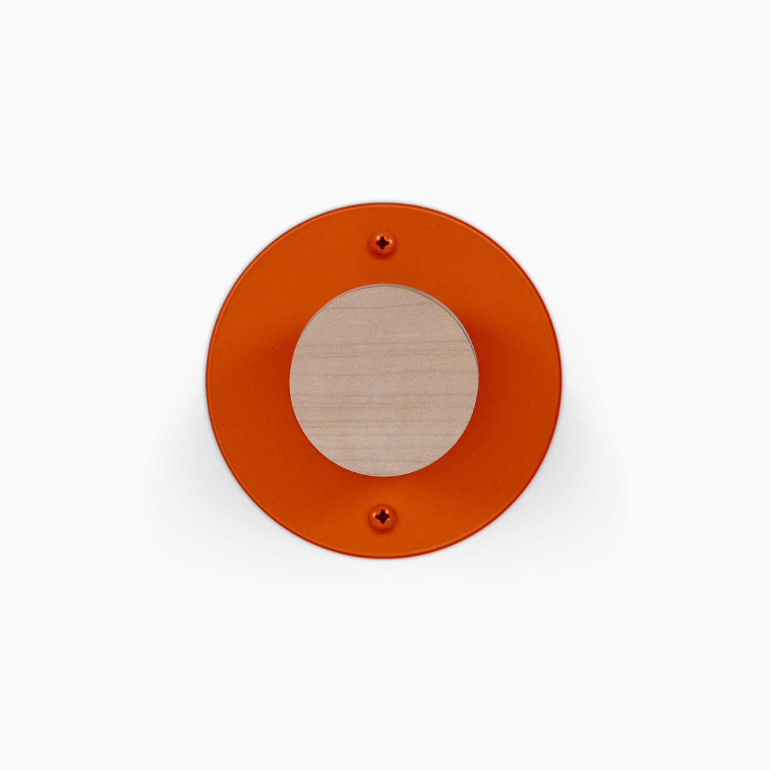 Runda Coat Rack 1 orange circular wall hook with a light wood center and two visible mounting screws