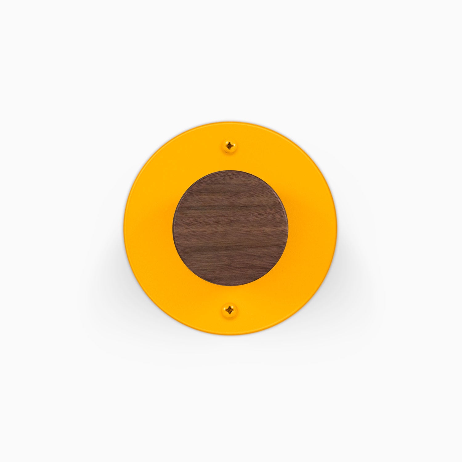 Runda Coat Rack 1 round orange wall hook with a contrasting walnut wood center and two visible mounting screws