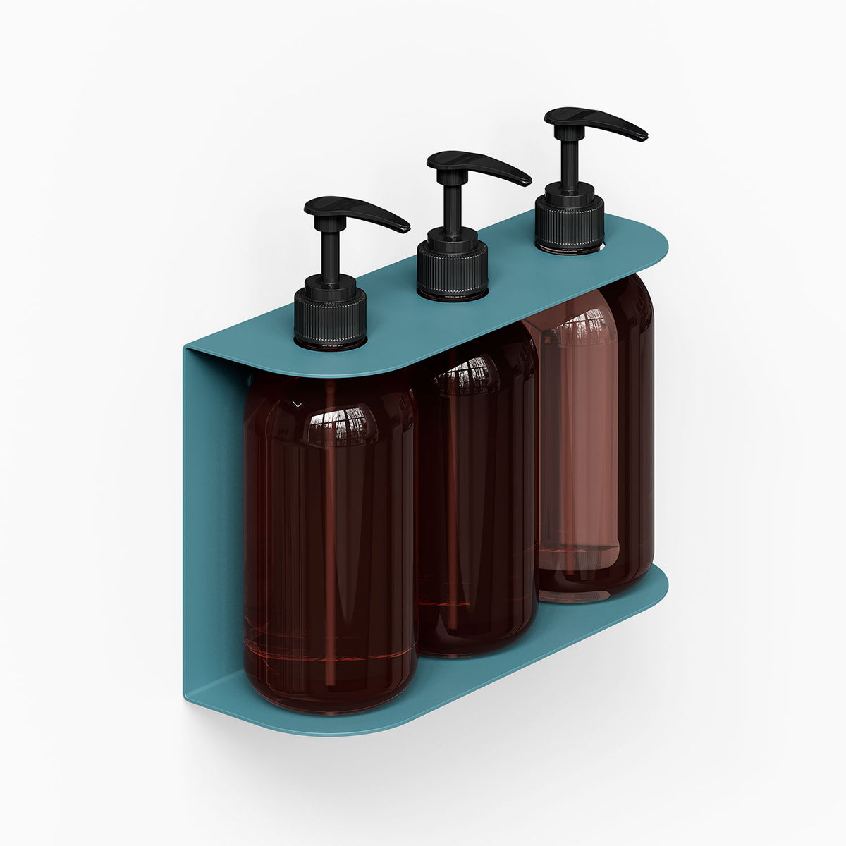 Soap Opera Shower Dispenser mounted on wall featuring three dark amber pump bottles held by a minimalist teal metal bracket designed for bathroom organization.