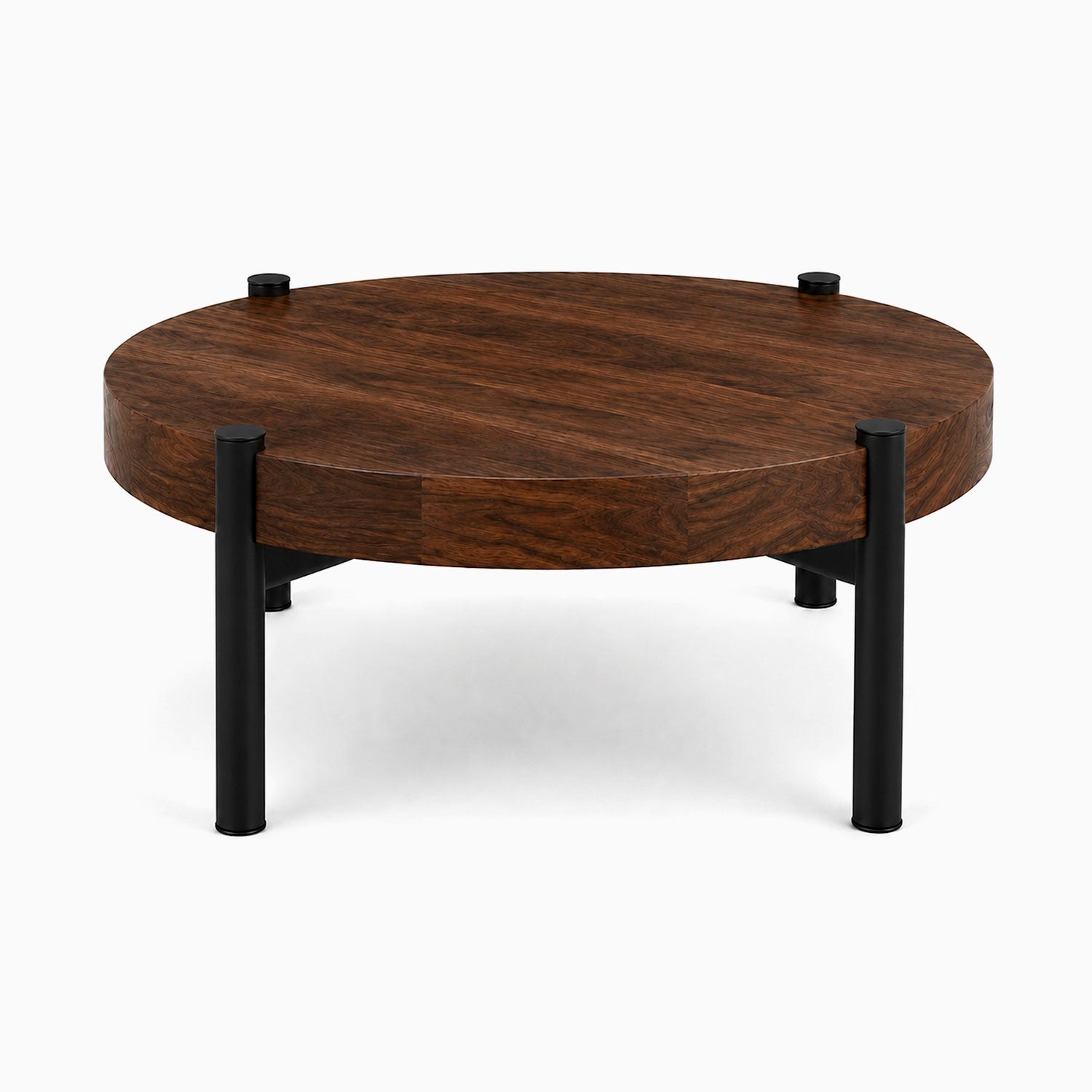Stay Coffee Table featuring a round solid hardwood walnut top with sturdy black steel legs, combining minimalist design with durable American-made craftsmanship.