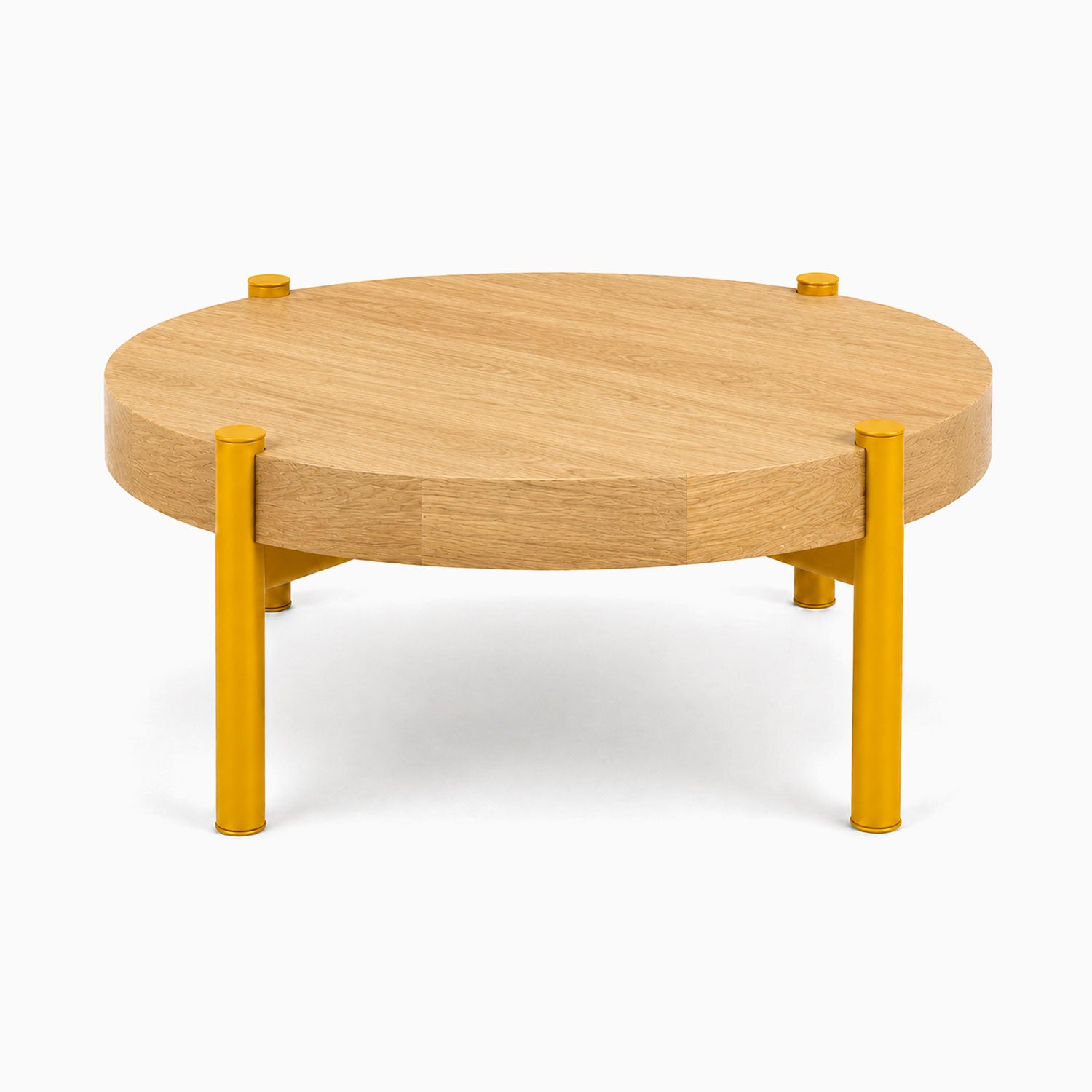 Stay Coffee Table with round solid hardwood top and vibrant yellow steel legs, combining minimalist design with functional durability.
