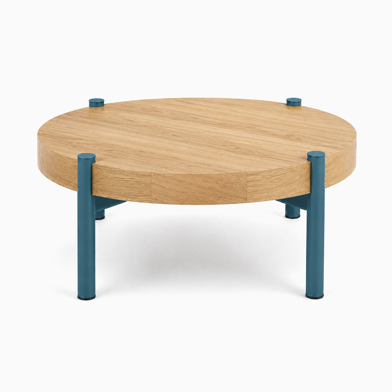 Stay Coffee Table featuring a round solid hardwood top and sturdy blue steel legs, combining minimalist design with durable American-made quality.