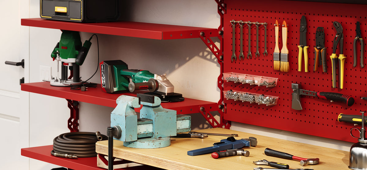 Organized workshop with red wall shelves and pegboard holding tools above a workbench with a vise and power tools
