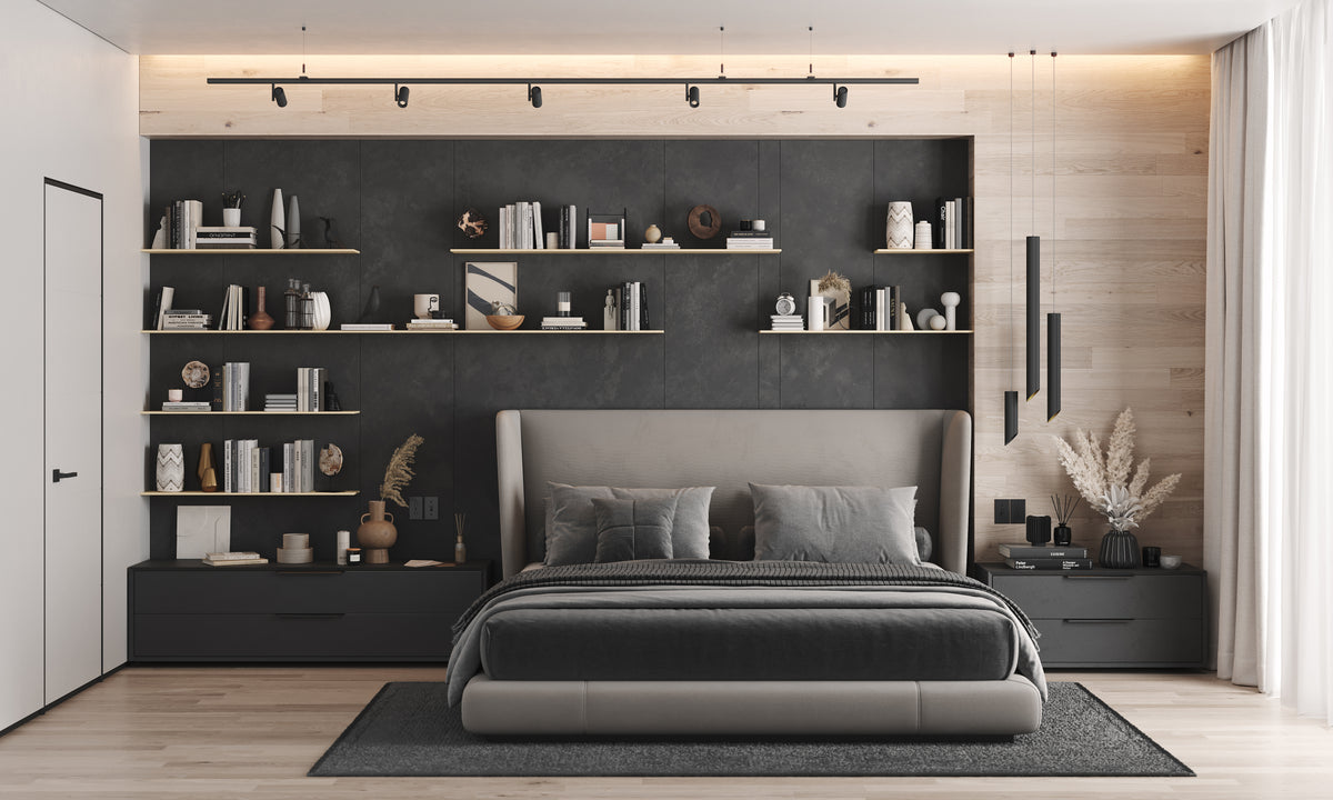Modern bedroom with dark built in wall shelves displaying books and decor beside a padded bed and warm wood accents