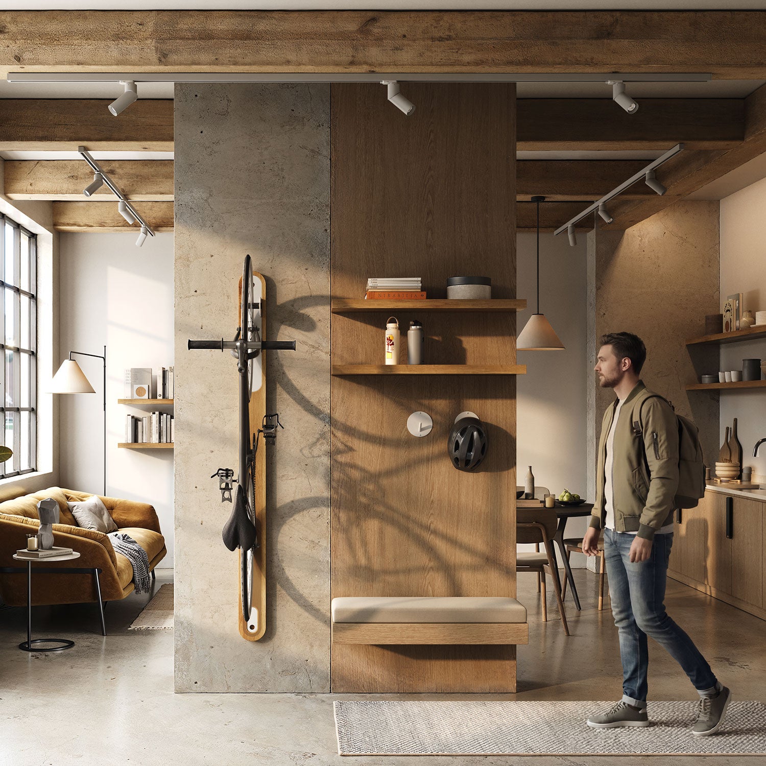 Studio apartment with intermediate wall, upon which hangs the Wallride vertical bike hanger in white oak and matte white. bike hangs on the hanger. A young man on the right side walking towards the hanging bike.