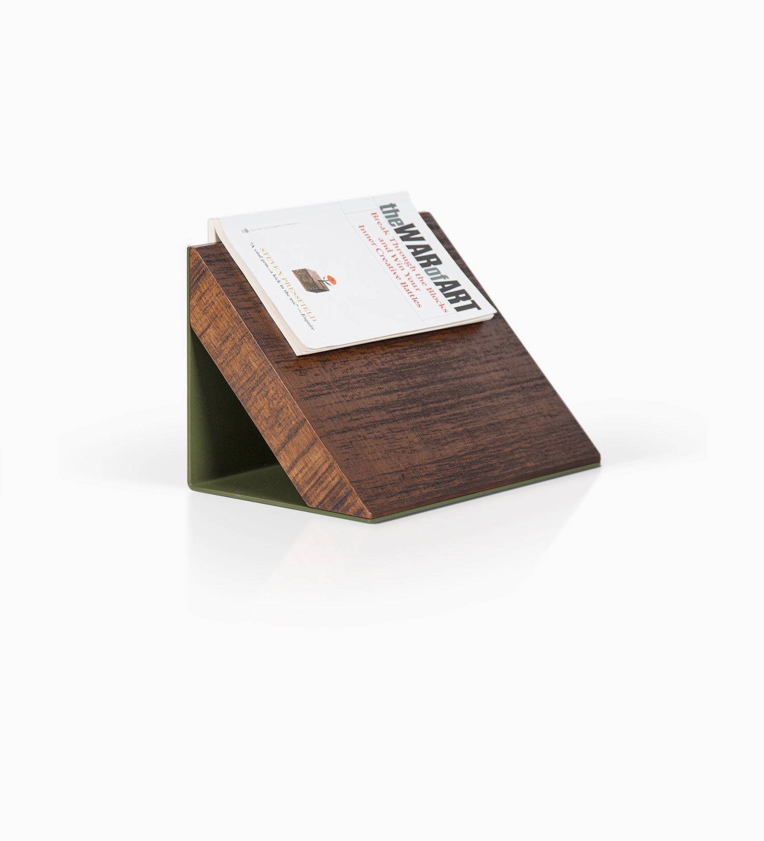 Three-quarter view of book holder with solid alder in rough nutmeg finish and forest green steel base