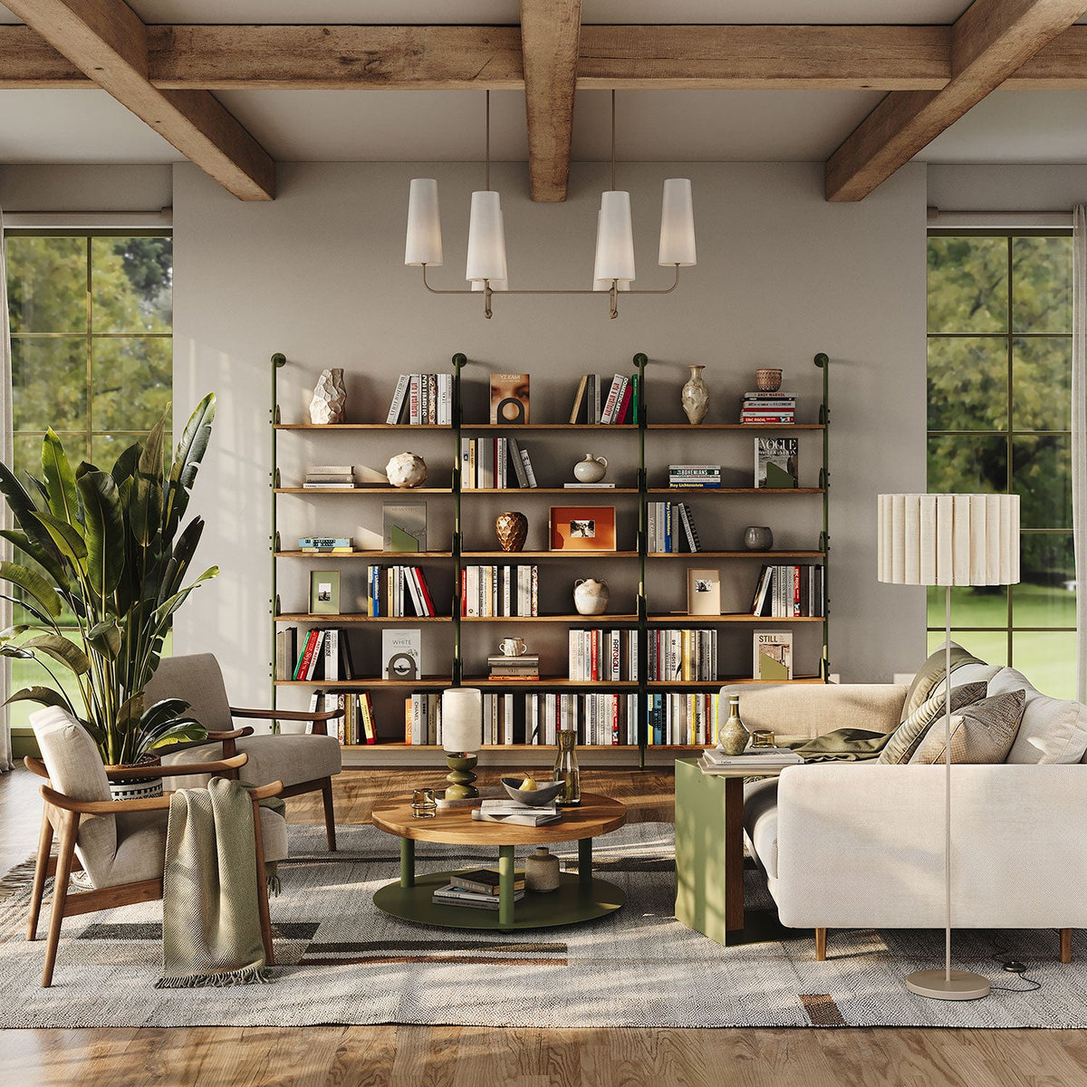 Warm living room with dark wood and metal wall shelves filled with books and decor beside a sofa coffee table and tall windows