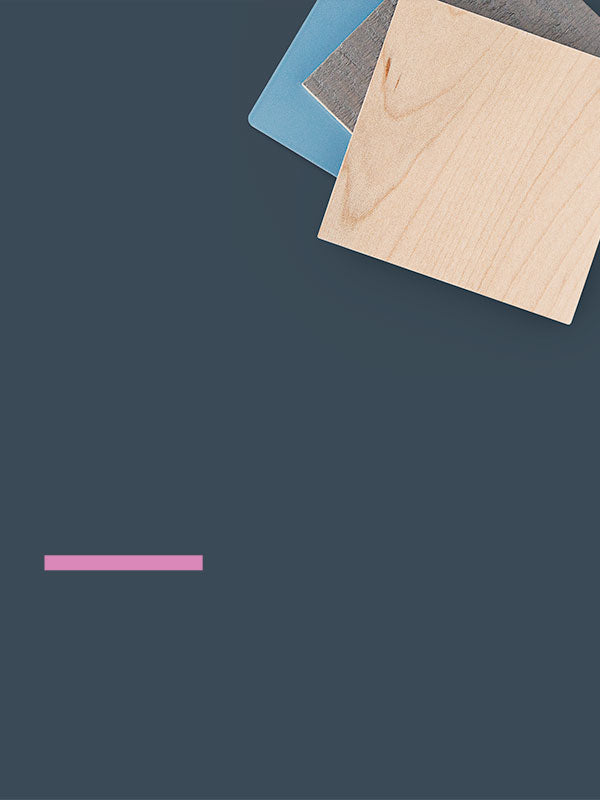 Three layered samples of natural wood, muted blue, and textured gray materials arranged on a dark slate background with a subtle horizontal pink accent below.