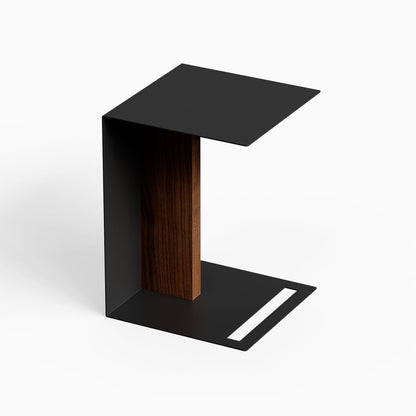 Baxter Side Table with a black metal frame and dark wood support in a minimalist modern design