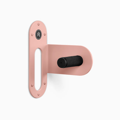 Spoke Bike Hanger – pink flash color, right orientation. Modern wall or ceiling-mounted bike hanger by Shelfology, USA-made powder coated steel.