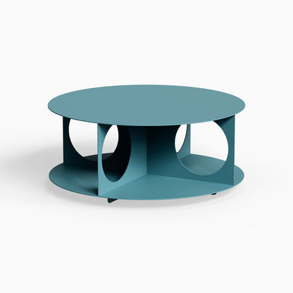 Bruno Coffee Table features a minimalist, durable steel design in muted blue with functional open storage and geometric cutouts.