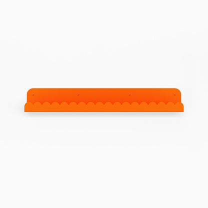 Mini Bubble Picture Ledge in bright orange steel with compact bubble edge for functional wall display and organization