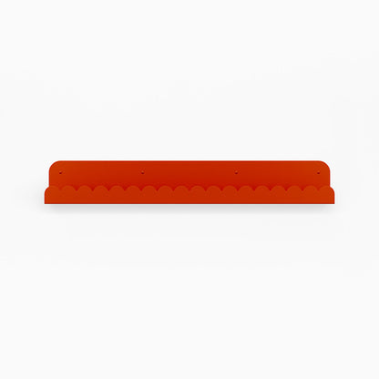 Mini Bubble Picture Ledge in vibrant orange steel with compact bubble pattern for functional wall display and organizing items