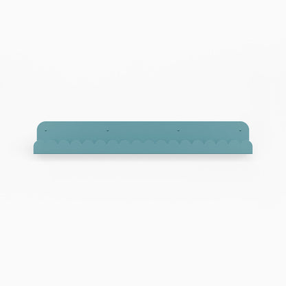 Mini Bubble Picture Ledge in steely blue steel with scalloped edge for minimalist wall shelf display and organization