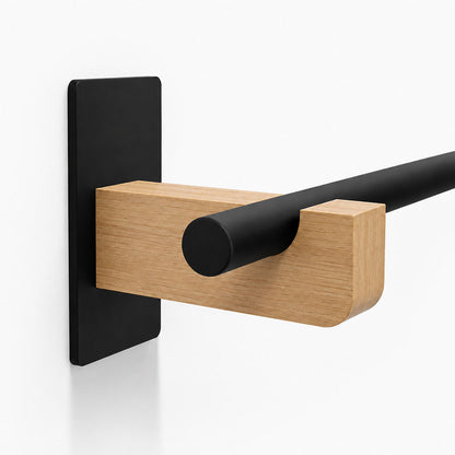 Draper Curtain Rod System featuring a minimalist black metal rod with a solid hardwood wall mount bracket for functional window decor.