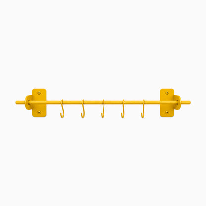 Etta Utensil Rack in honey mustard with six hooks and a minimalist design, crafted from durable metal for organized wall storage and display.
