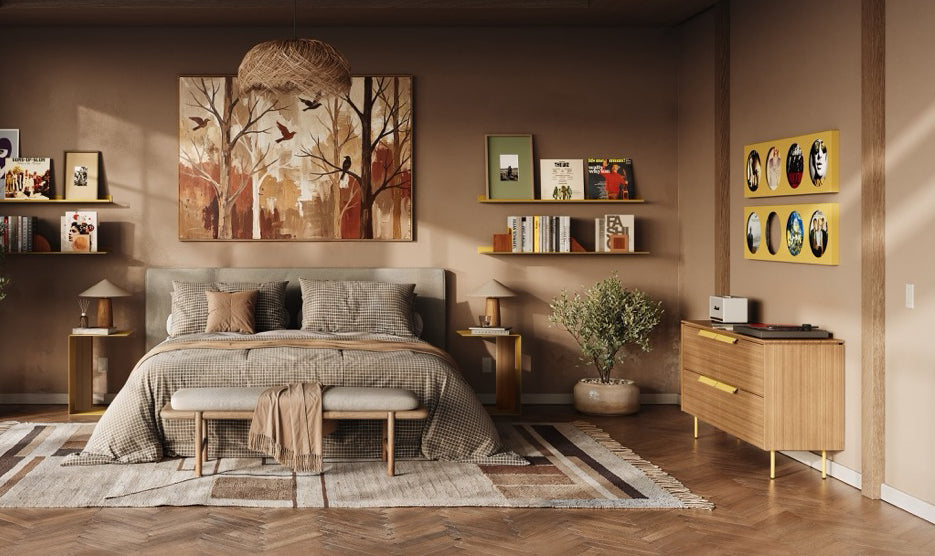 Warm modern bedroom with a low platform bed, wall shelves displaying books and art, wood dresser, rug, and indoor plants