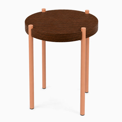 Fern Plant Stand (Walnut) with a round solid walnut top and minimalist peach-colored metal legs, combining wood and steel for modern display and organization.