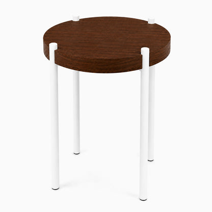 Fern Plant Stand (Walnut) featuring a round solid hardwood walnut top with minimalist white metal legs, blending wood and steel for a durable mixed-material design.