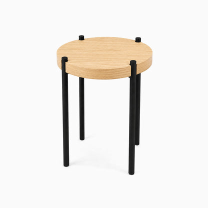 Minimalist Fern Plant Stand (White Oak) with a round solid hardwood top supported by durable black metal legs, designed for stylish organization.