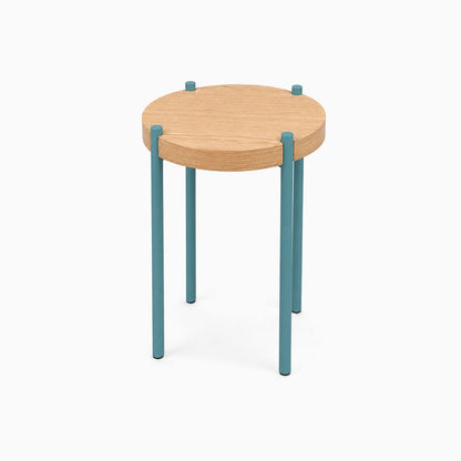 Fern Plant Stand (White Oak) featuring a minimalist round white oak top with sturdy blue metal legs, designed for stylish and functional display.