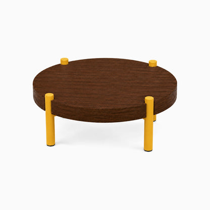 Fern Plant Stand (Walnut) with a minimalist round walnut wood top and sturdy yellow metal legs, ideal for organizing and displaying plants.
