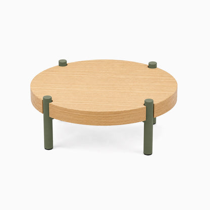 Fern Plant Stand (White Oak) with a round solid hardwood top and four short olive green metal legs, minimalist and functional design.