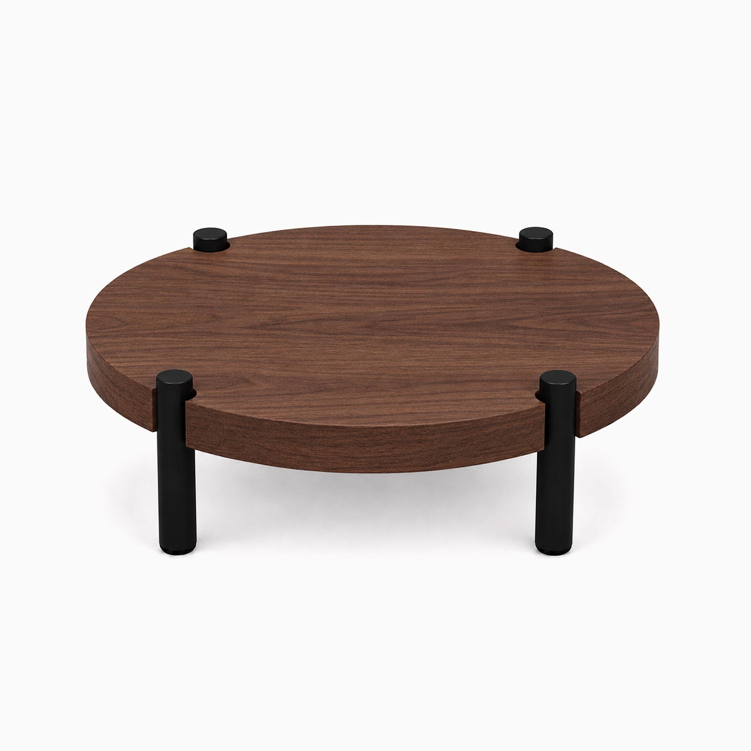 Fern Plant Stand (Walnut) featuring a minimalist round walnut wood platform with four sturdy black metal legs, perfect for displaying plants and decor.