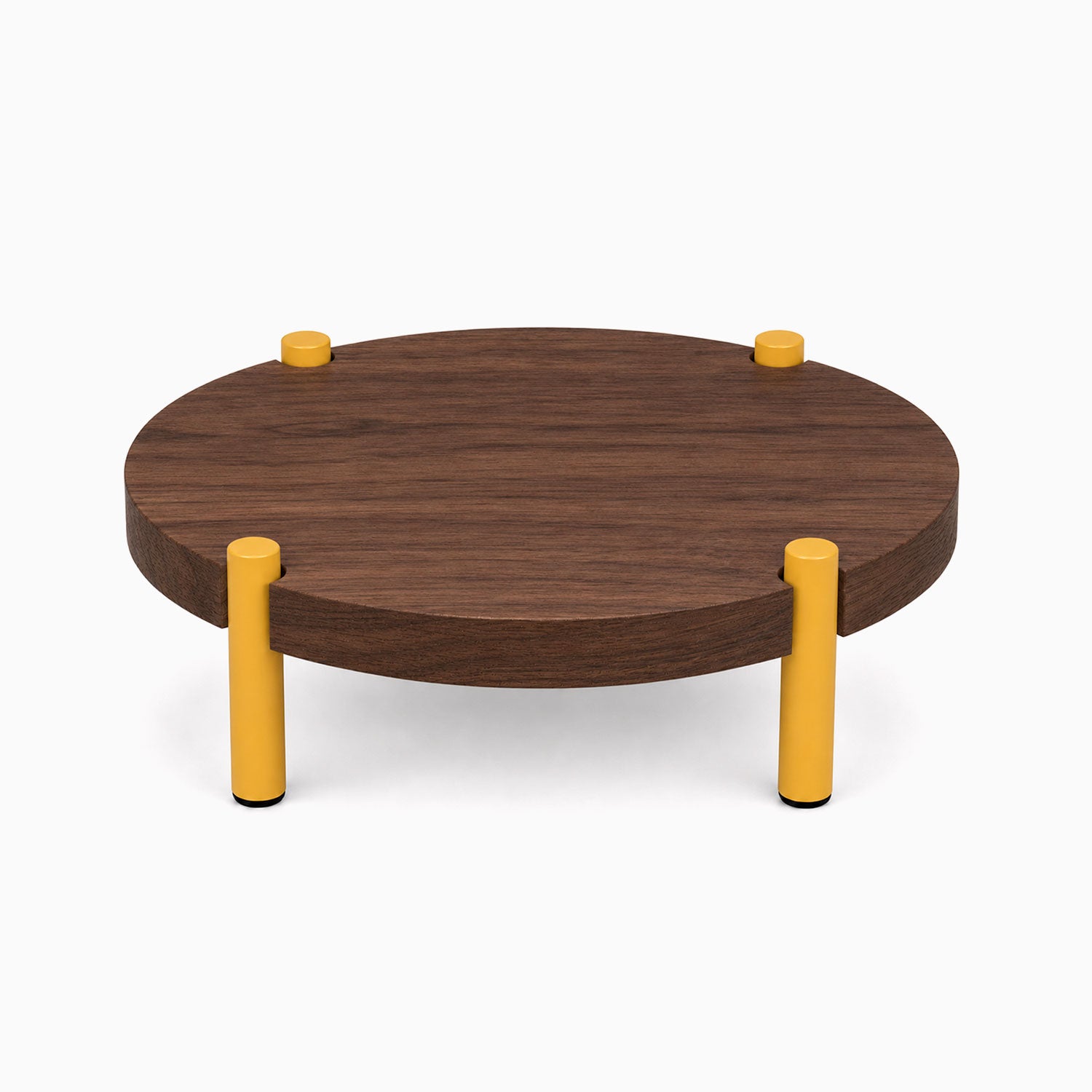 Fern Plant Stand (Walnut) with a round walnut wood top and four sturdy yellow legs, combining minimalist design with functional elegance.