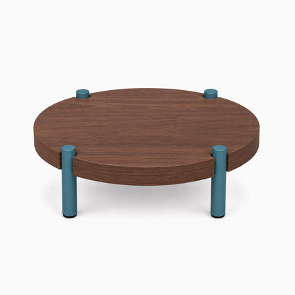 Fern Plant Stand (Walnut) featuring a round walnut wood top supported by four teal steel legs, combining solid hardwood and metal for modern display and organization.