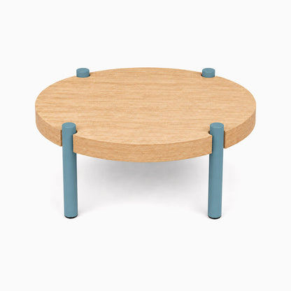 Fern Plant Stand (White Oak) with a round wood surface and sturdy steel legs in muted blue, blending natural and modern design.