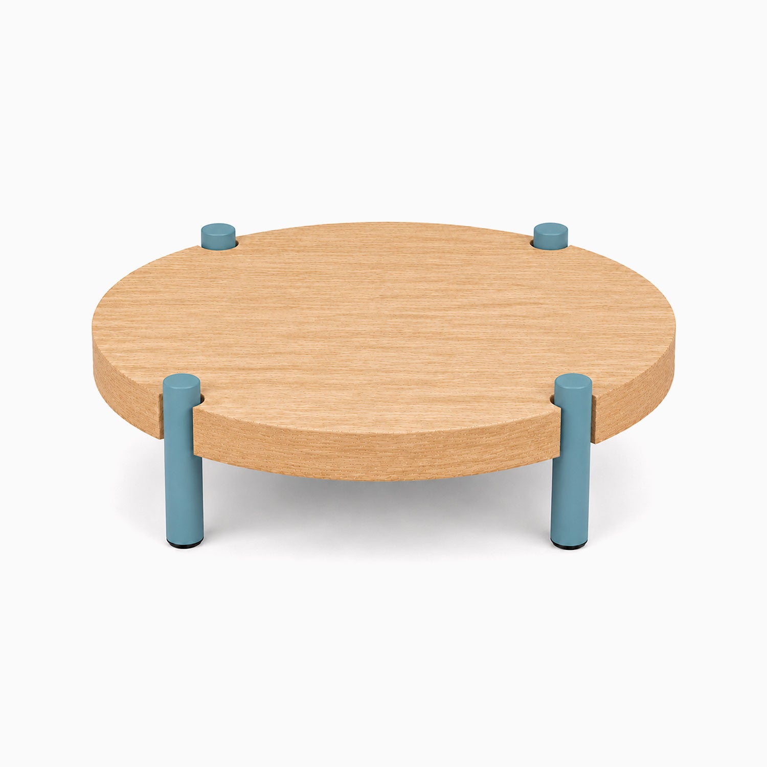 Fern Plant Stand (White Oak) with a round solid hardwood top supported by four short steel legs in a muted blue finish for minimalist display and organization.