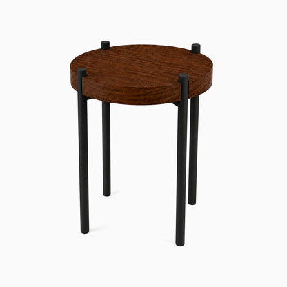 Fern Plant Stand (Walnut) with minimalist round walnut top and black metal legs, combining solid hardwood and steel for durable display and organization.