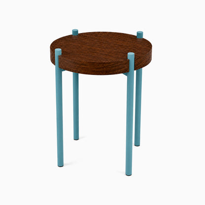 Fern Plant Stand (Walnut) featuring a round walnut wood top with minimalist blue steel legs, blending solid hardwood and metal for functional decor.