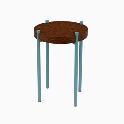 Fern Plant Stand (Walnut) featuring a round solid walnut top supported by four slender blue steel legs in a minimalist functional design.