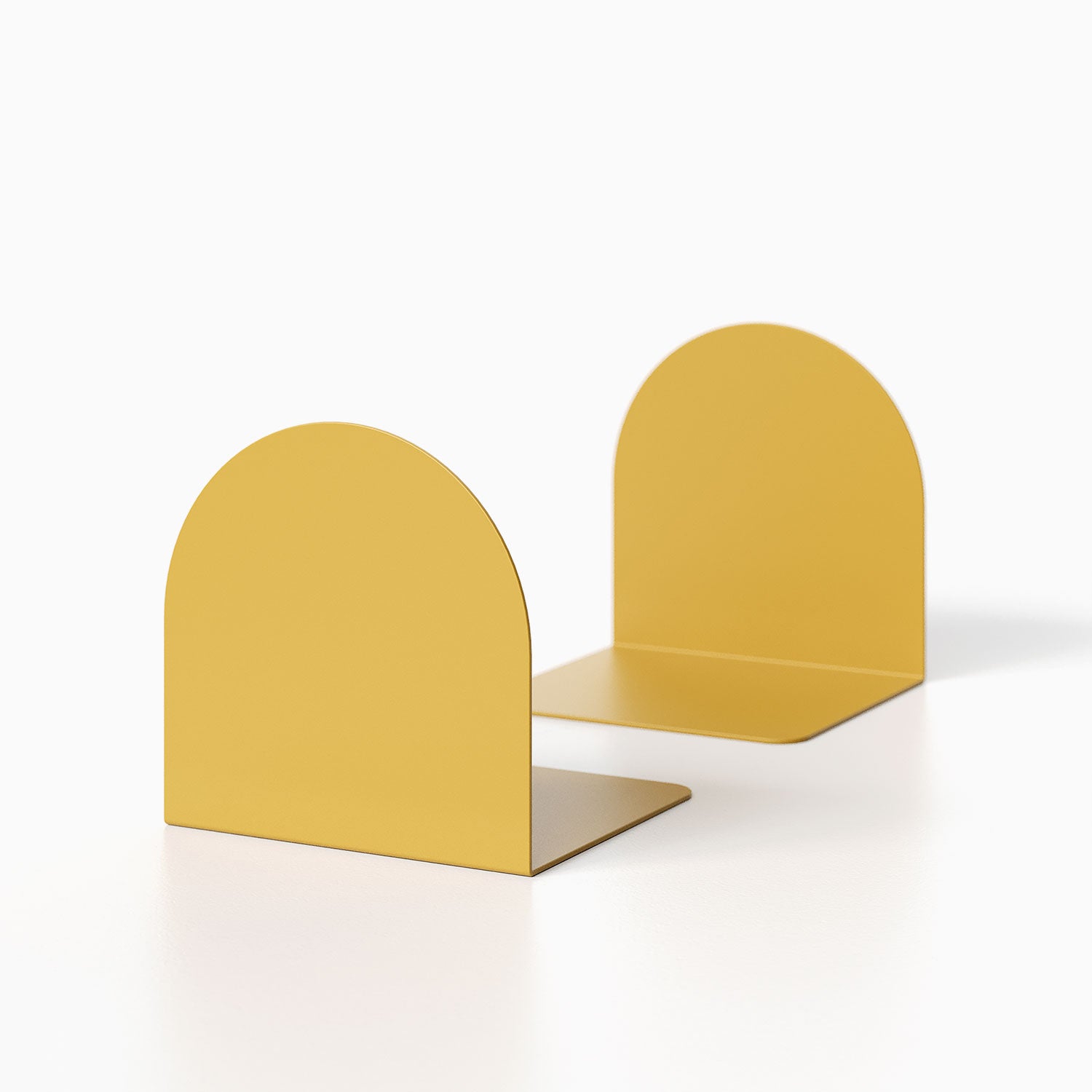 Geo Round Bookend (Set of Two) in mustard yellow with a minimalist rounded design, ideal for functional wall shelves and display ledges.