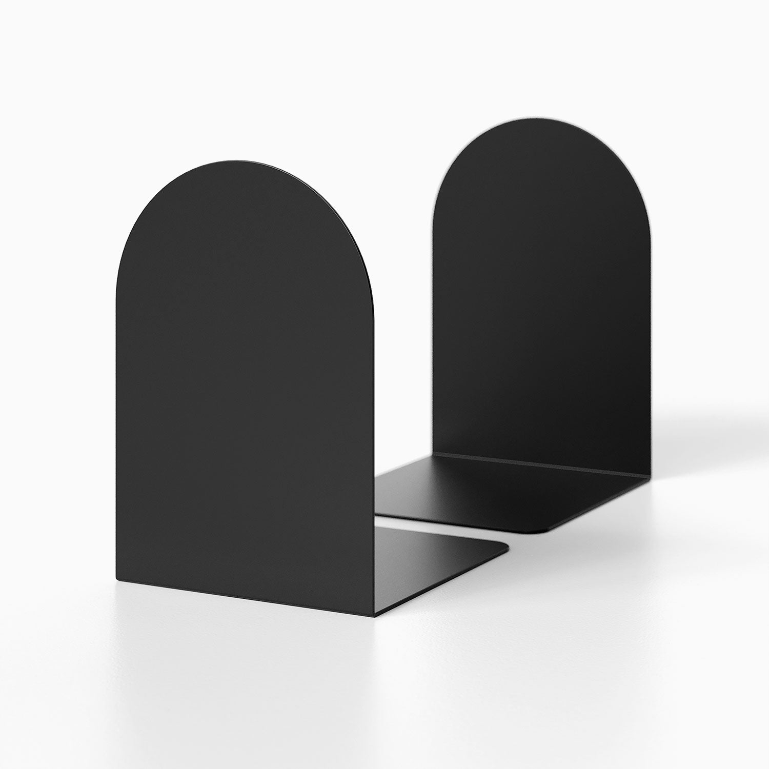 Geo Round Bookend (Set of Two) in matte black metal with minimalist rounded design, perfect for organizing books and enhancing shelf display.