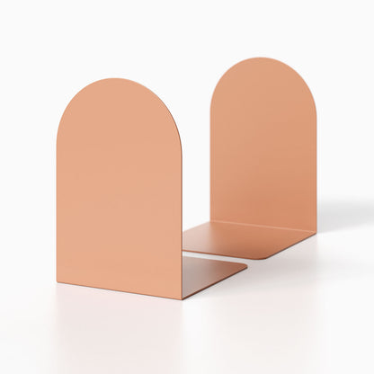 Pair of minimalist Geo Round Bookend (Set of Two) in matte peach metal, designed for functional bookshelf organization and modern decor.