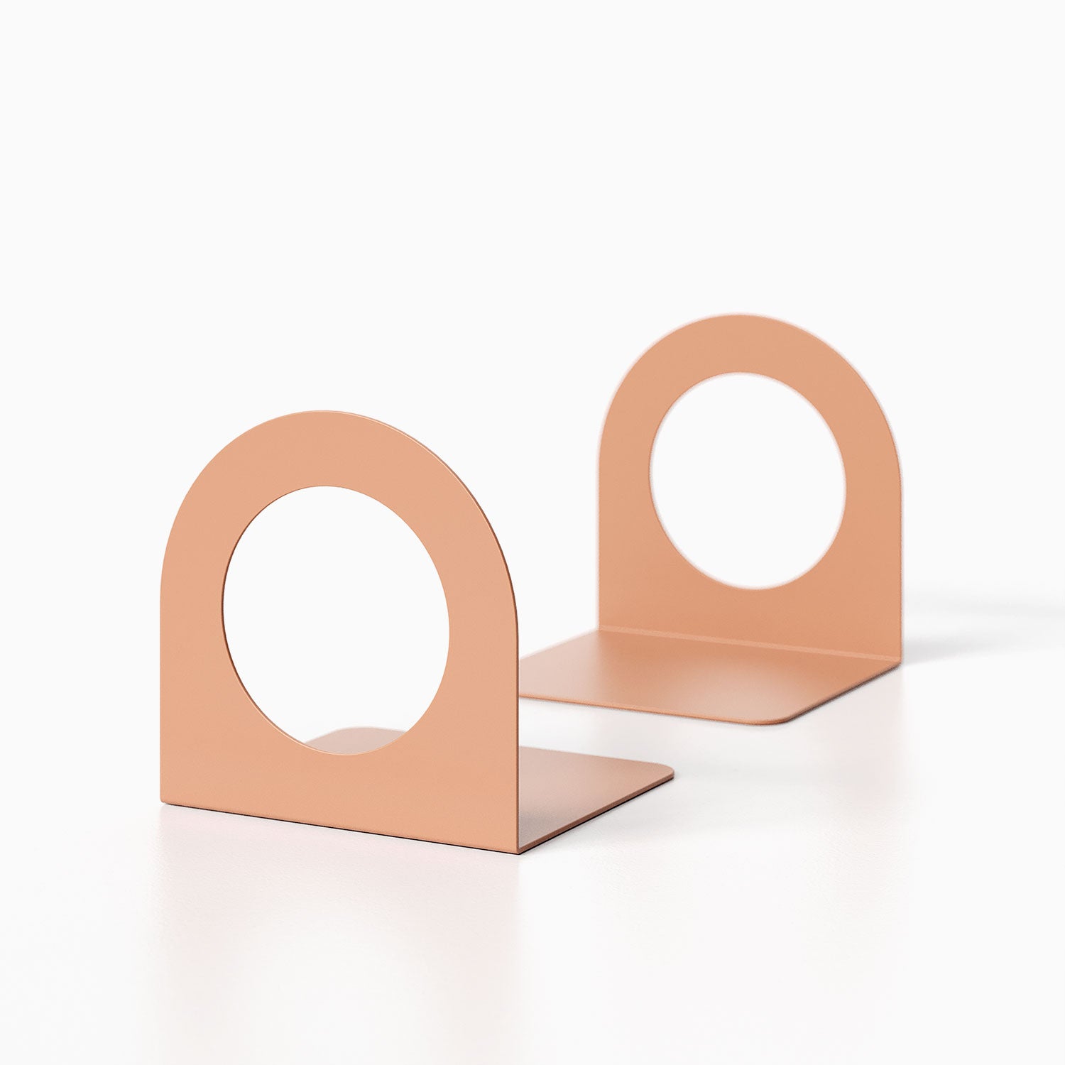 Geo Round Open Bookend (Set of Two) in minimalist metal design with a round cutout, perfect for stylish and functional shelf organization.