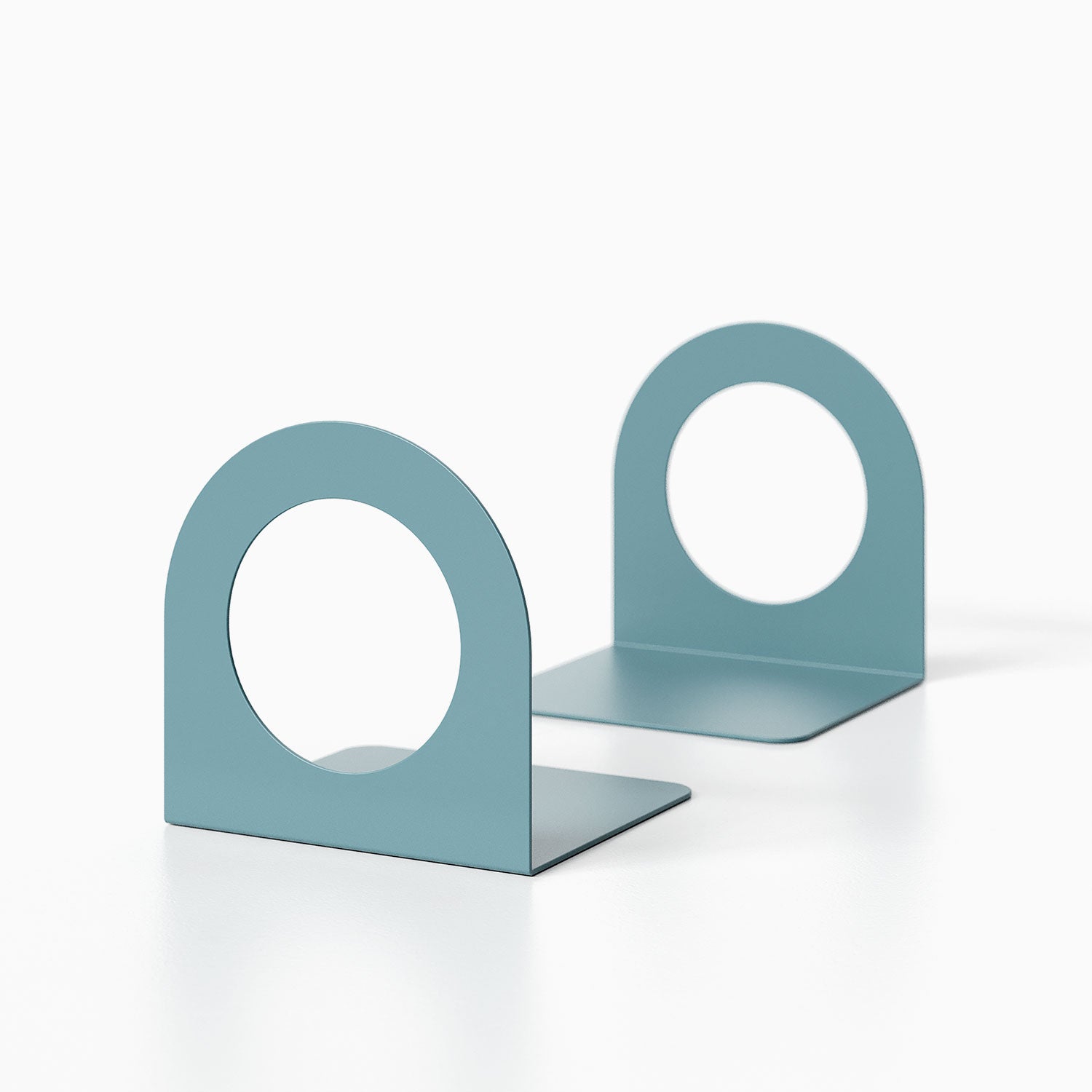 Geo Round Open Bookend (Set of Two) in minimalist steel design with circular cutout, perfect for modern shelf and wall display organization.
