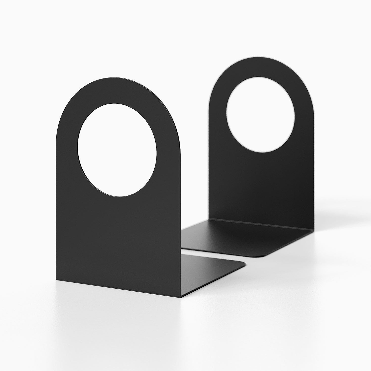Minimalist black metal Geo Round Open Bookend (Set of Two) with round cutout design for functional shelf and wall display organization.