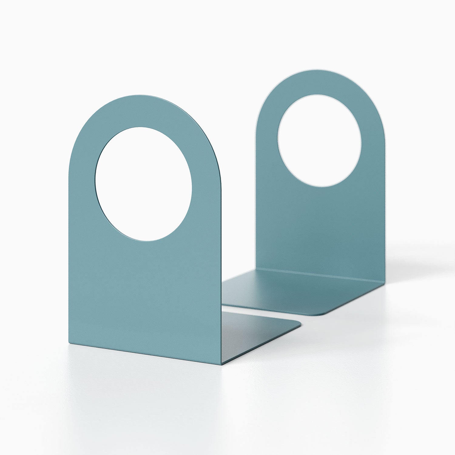 Pair of minimalist blue metal Geo Round Open Bookend (Set of Two) with circular cutouts designed for modern shelf and wall display organization.